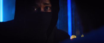 Movie still from “Death Note” (2017), directed by Adam Wingard – A man with a black mask on his face; Close Up shot, Over the shoulder angle
