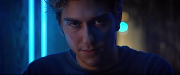 Movie still from “Death Note” (2017), directed by Adam Wingard – A man's face in the dark; Close Up shot, Low angle