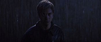 Movie still from “Death Note” (2017), directed by Adam Wingard – A young man in the dark with his ear piercing; Close Up shot, Low angle