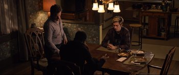 Movie still from “Death Note” (2017), directed by Adam Wingard – A group of people sitting around a table; Medium shot, High angle