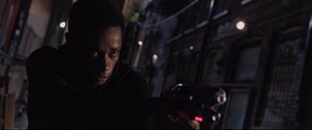 Movie still from “Death Note” (2017), directed by Adam Wingard – A man is looking at the camera in the dark; Close Up shot, Low angle