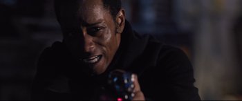 Movie still from “Death Note” (2017), directed by Adam Wingard – A person holding a remote control; Close Up shot, Over the shoulder angle