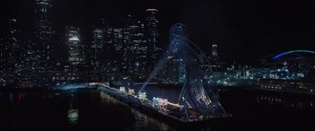 Movie still from “Death Note” (2017), directed by Adam Wingard – A city lit up at night with a ferris wheel in the middle of it; Extreme Wide shot, High angle