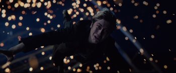 Movie still from “Death Note” (2017), directed by Adam Wingard – A man in a black jacket is looking at the camera; Medium shot, Overhead angle