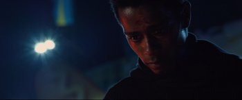 Movie still from “Death Note” (2017), directed by Adam Wingard – A person wearing a black shirt; Close Up shot, Low angle