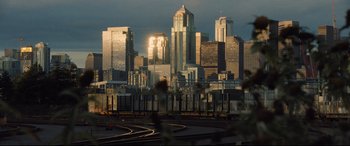 Movie still from “Death Note” (2017), directed by Adam Wingard – A view of a city skyline from across the tracks; Extreme Wide shot, High angle