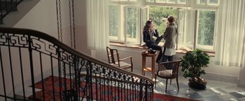 Movie still from “Clouds of Sils Maria” (2014), directed by Olivier Assayas – A group of people sitting at a table near a window; Wide shot, High angle
