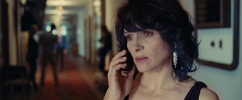 Movie still from “Clouds of Sils Maria” (2014), directed by Olivier Assayas – A person talking on a cell phone; Close Up shot, High angle