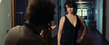 Movie still from “Clouds of Sils Maria” (2014), directed by Olivier Assayas – A woman in a black dress is looking at a man in a black suit; Medium shot, Over the shoulder angle
