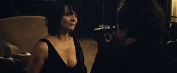 Movie still from “Clouds of Sils Maria” (2014), directed by Olivier Assayas – A woman in a black dress talking to a man in a black suit; Close Up shot, Over the shoulder angle