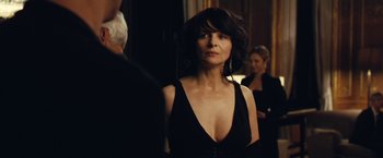 Movie still from “Clouds of Sils Maria” (2014), directed by Olivier Assayas – A woman in a black dress standing next to a man; Close Up shot, Over the shoulder angle