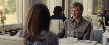 Movie still from “Clouds of Sils Maria” (2014), directed by Olivier Assayas – A man and woman sitting at a dinner table; Medium shot, Over the shoulder angle