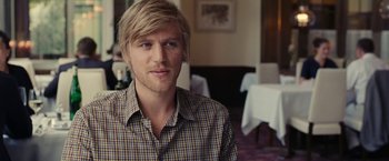 Movie still from “Clouds of Sils Maria” (2014), directed by Olivier Assayas – A person wearing a plaid shirt; Close Up shot, Over the shoulder angle
