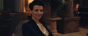 Movie still from “Clouds of Sils Maria” (2014), directed by Olivier Assayas – A woman sitting in a chair wearing a jacket; Close Up shot, Over the shoulder angle