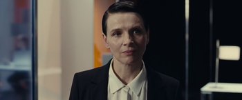 Movie still from “Clouds of Sils Maria” (2014), directed by Olivier Assayas – A woman with short hair wearing a black suit; Close Up shot, Low angle