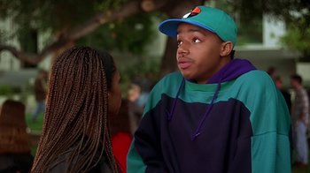 Movie still from “Clueless” (1995), directed by Amy Heckerling – A man and a woman talking to each other; Medium shot, Over the shoulder angle