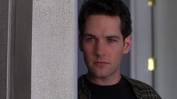 Movie still from “Clueless” (1995), directed by Amy Heckerling – A person wearing a black shirt; Close Up shot, Low angle