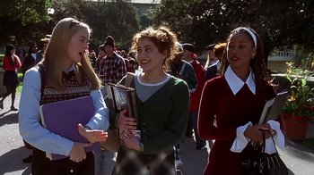 Movie still from “Clueless” (1995), directed by Amy Heckerling – A group of young people walking down a street; Medium shot, High angle