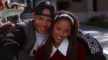Movie still from “Clueless” (1995), directed by Amy Heckerling – A man and a woman posing for a picture; Close Up shot, High angle