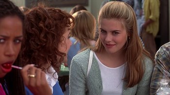 Movie still from “Clueless” (1995), directed by Amy Heckerling – Two young women talking to each other in a crowd; Close Up shot, Over the shoulder angle