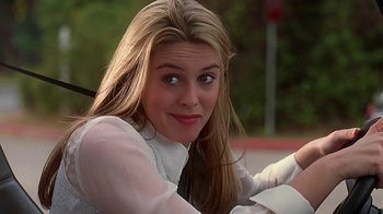 Movie still from “Clueless” (1995), directed by Amy Heckerling – A woman with long blonde hair sitting in a car; Close Up shot, Over the shoulder angle