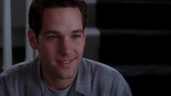 Movie still from “Clueless” (1995), directed by Amy Heckerling – A man smiling for the camera; Close Up shot, Low angle