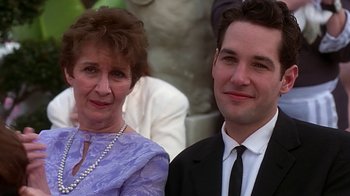 Movie still from “Clueless” (1995), directed by Amy Heckerling – A man and a woman standing next to each other; Close Up shot, Low angle