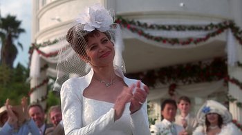 Movie still from “Clueless” (1995), directed by Amy Heckerling – A woman wearing a white dress and a veil; Close Up shot, Low angle