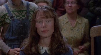 Movie still from “Coal Miner's Daughter” (1980), directed by Michael Apted – A person with long brown hair; Close Up shot, High angle