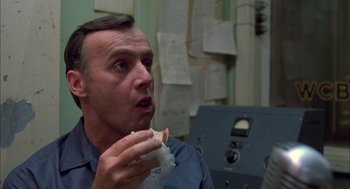 Movie still from “Coal Miner's Daughter” (1980), directed by Michael Apted – A person eating a sandwich; Close Up shot, Low angle