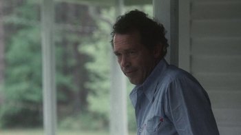 Movie still from “Cockfighter” (1974), directed by Monte Hellman – A person leaning against a window sill; Medium shot, Over the shoulder angle