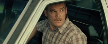 Movie still from “Cold in July” (2014), directed by Jim Mickle – A person in a car; Close Up shot, Over the shoulder angle