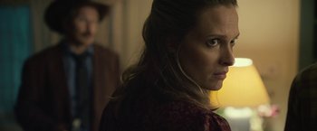 Movie still from “Cold in July” (2014), directed by Jim Mickle – A person wearing a red shirt; Close Up shot, Over the shoulder angle