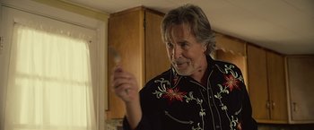 Movie still from “Cold in July” (2014), directed by Jim Mickle – A man holding a spoon in his hand; Close Up shot, Over the shoulder angle