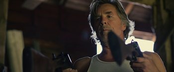 Movie still from “Cold in July” (2014), directed by Jim Mickle – A person holding a video game controller; Close Up shot, Low angle