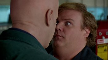 Movie still from “Coneheads” (1993), directed by Steve Barron – A man looking into a mirror with a bald head; Close Up shot, Over the shoulder angle