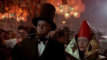 Movie still from “Coneheads” (1993), directed by Steve Barron – A group of people in costumes at a party; Close Up shot, Low angle