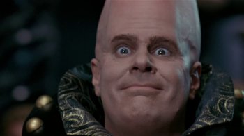 Movie still from “Coneheads” (1993), directed by Steve Barron – A man with a bald head is looking at the camera; Close Up shot, Low angle