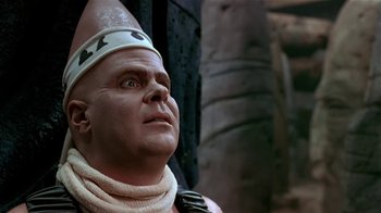 Movie still from “Coneheads” (1993), directed by Steve Barron – A person wearing a helmet; Close Up shot, Low angle