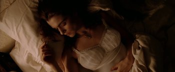 Movie still from “Constantine” (2005), directed by Francis Lawrence – A woman in a white dress laying on a bed; Close Up shot, Overhead angle
