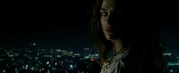 Movie still from “Constantine” (2005), directed by Francis Lawrence – A person with a city in the background; Close Up shot, Low angle