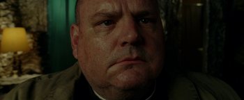 Movie still from “Constantine” (2005), directed by Francis Lawrence – A man's face with a frowning look; Close Up shot, Low angle