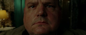 Movie still from “Constantine” (2005), directed by Francis Lawrence – A man's face in the dark; Extreme Close Up shot, Low angle