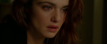 Movie still from “Constantine” (2005), directed by Francis Lawrence – A woman's face with tears in her eyes; Close Up shot, Over the shoulder angle