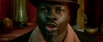 Movie still from “Constantine” (2005), directed by Francis Lawrence – A person wearing a hat; Close Up shot, Low angle
