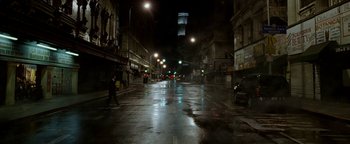 Movie still from “Constantine” (2005), directed by Francis Lawrence – A city street at night lit by street lights; Extreme Wide shot, Low angle