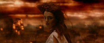 Movie still from “Constantine” (2005), directed by Francis Lawrence – A woman with long red hair and a white shirt; Close Up shot, High angle