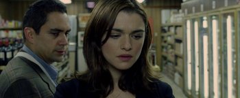 Movie still from “Constantine” (2005), directed by Francis Lawrence – A person with long brown hair; Close Up shot, Over the shoulder angle