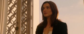 Movie still from “Constantine” (2005), directed by Francis Lawrence – A beautiful woman with long brown hair wearing a black jacket; Close Up shot, Over the shoulder angle