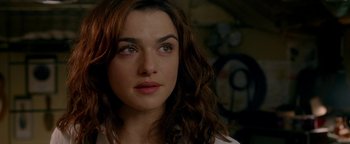 Movie still from “Constantine” (2005), directed by Francis Lawrence – A person with long brown hair; Close Up shot, Over the shoulder angle